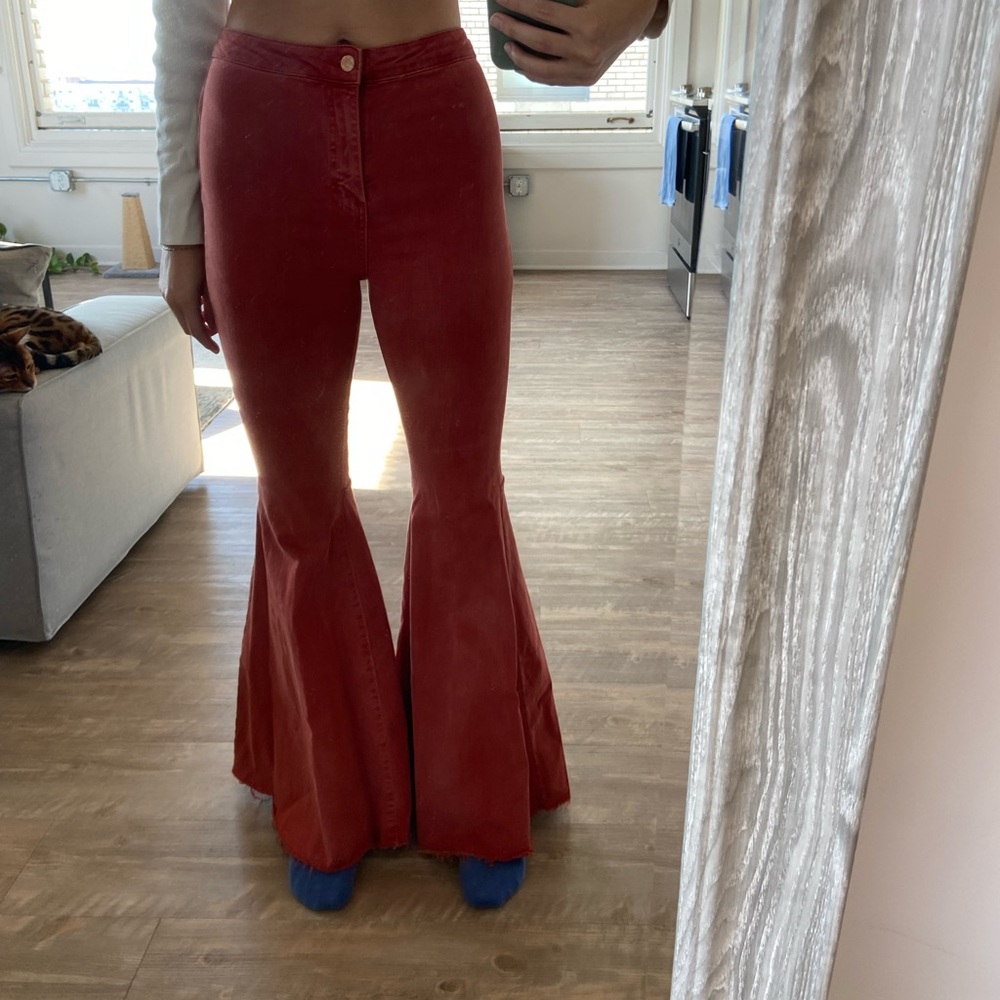 Free people burnt orange bell bottom jeans
